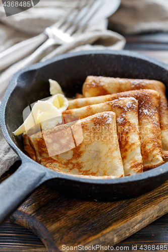 Image of Crepes with butter for breakfast.