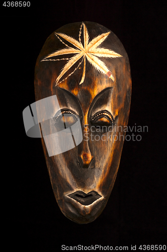 Image of African wooden mask on black