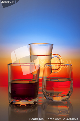 Image of Glasses with drinks on beautiful gradient background