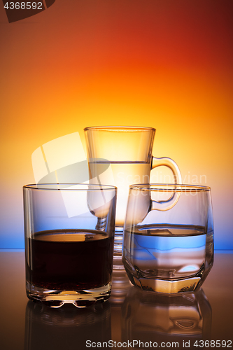 Image of Glasses with beverages on beautiful gradient background