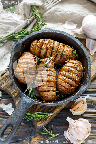 Image of Frying pan with roasted potatoes and rosemary.
