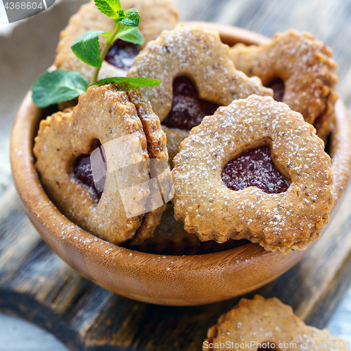 Image of Cookies in the form of hearts in a wooden bowl.