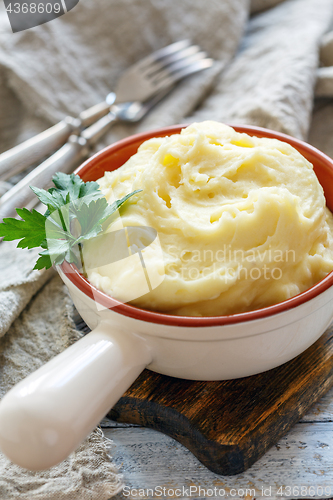 Image of Homemade mashed potatoes with butter.