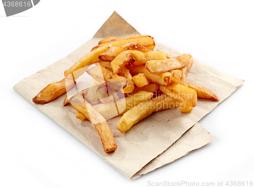 Image of fried potatoes on wrapping paper