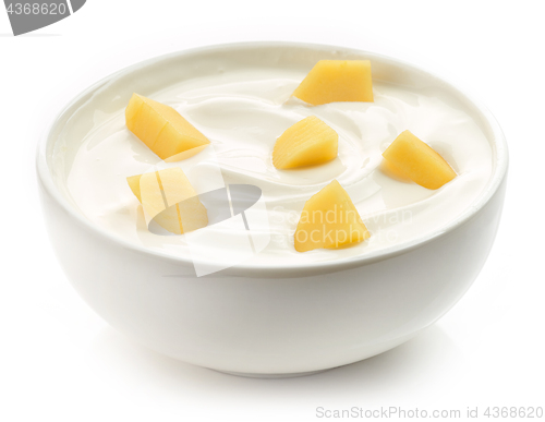 Image of bowl of yogurt with mango pieces