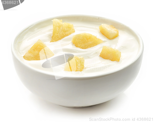 Image of bowl of yogurt with pineapple pieces