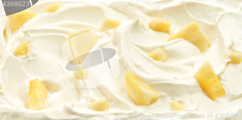 Image of whipped cream with pineapple pieces