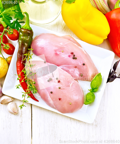 Image of Chicken breast raw in plate top