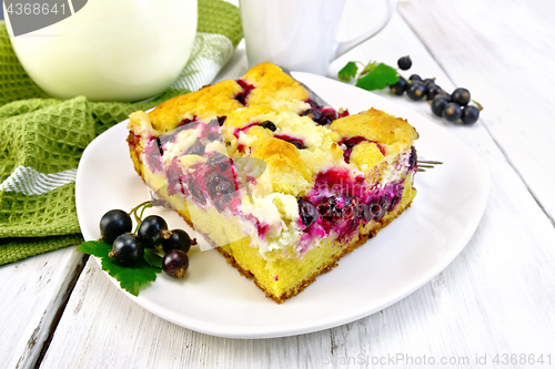 Image of Pie with black currant in plate on light board