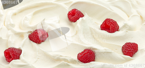 Image of whipped cream with raspberries