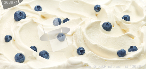 Image of whipped cream with blueberries