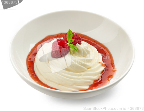 Image of whipped cream with raspberry sauce