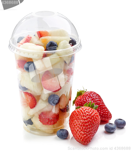 Image of fresh fruit pieces salad in plastic cup