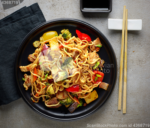 Image of Plate of noodles with meat and vegetables