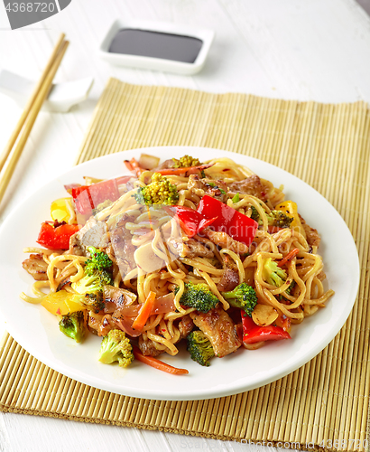 Image of Plate of noodles with meat and vegetables