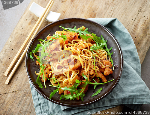 Image of Plate of asian noodles with fried meat
