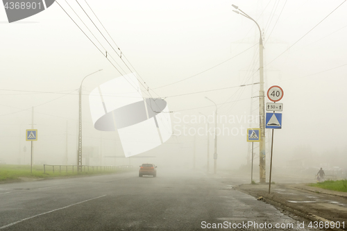 Image of Dense fog in summer in city on the highway