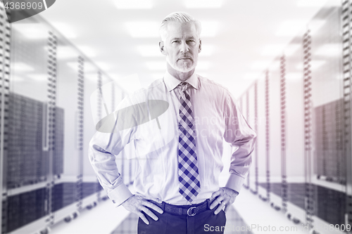 Image of Senior businessman in server room