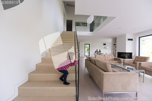 Image of family with little girl enjoys in the modern living room