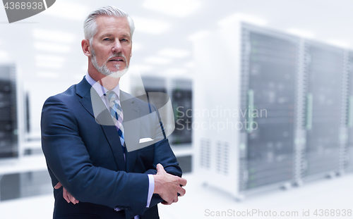 Image of Senior businessman in server room