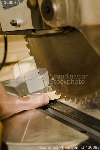 Image of Power Saw Cutting Off A Thumb