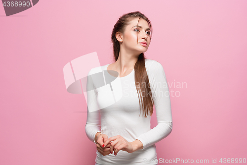 Image of The young woman\'s portrait with thoughtful emotions