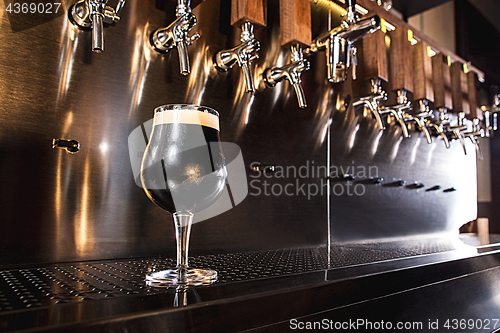 Image of Beer taps in a pub