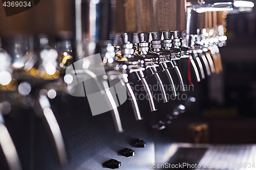 Image of Beer taps in a pub