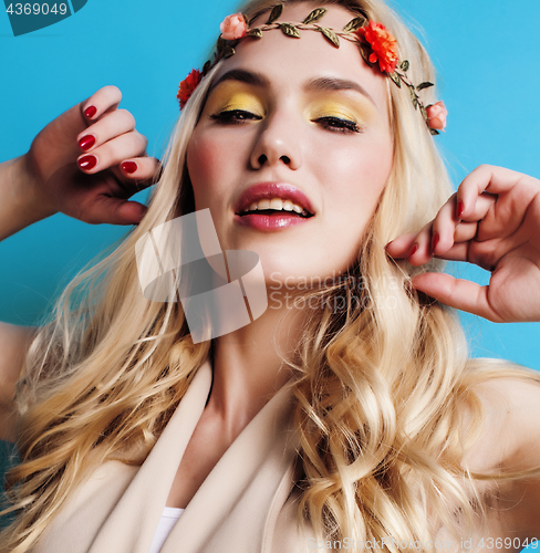 Image of young blond woman dressed like ancient greek godess, gold jewelry close up isolated, beautiful girl hands manicured red nails copyspace
