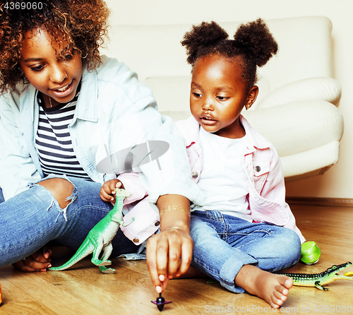 Image of adorable sweet young afro-american mother with cute little daugh