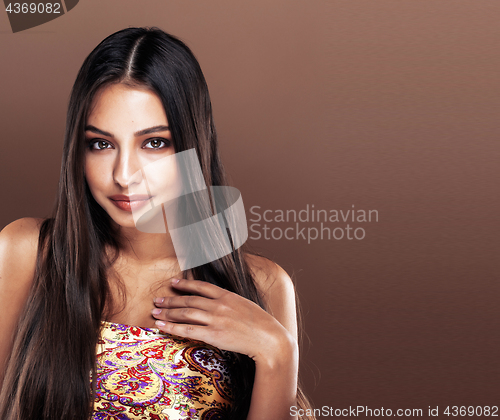Image of cute happy young indian woman in studio close up smiling, fashio