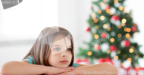 Image of beautiful sad or bored girl at christmas