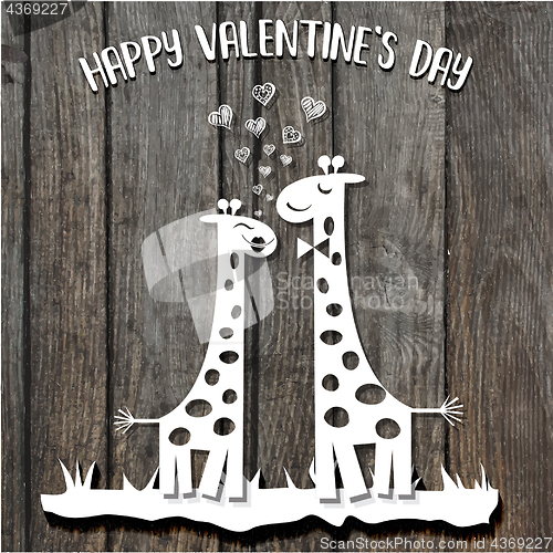 Image of paper cut giraffes in love, Valentine\'s Day card on wooden backg