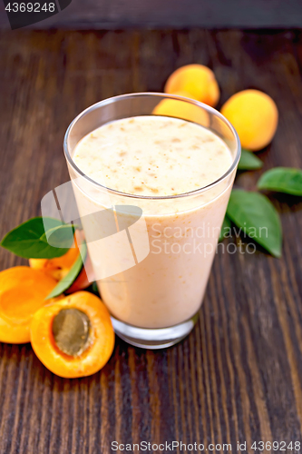 Image of Milkshake apricot in high glassful on board