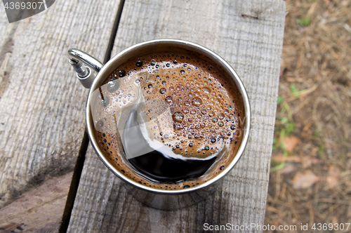 Image of Metal mug of coffee