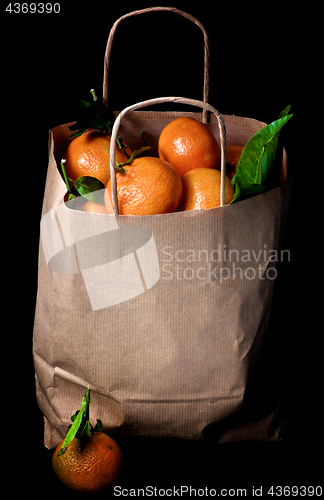 Image of Ripe Tangerines with Leafs