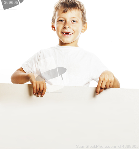 Image of little cute boy holding empty shit to copyspace isolated close u