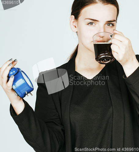 Image of young beauty woman in business style costume waking up for work 