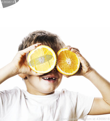 Image of little cute boy with orange fruit double isolated on white smili