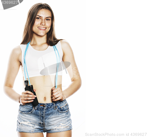 Image of young pretty woman with skipping rope isolated on white