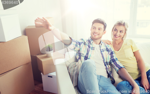 Image of couple with boxes moving to new home and dreaming