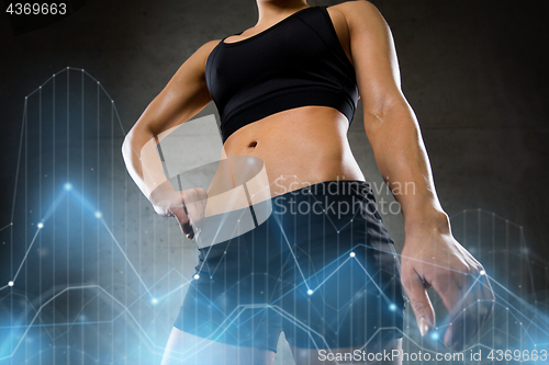 Image of young woman body in gym