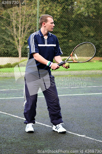 Image of Male Playing Tennis