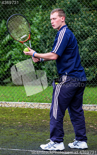 Image of Male playing Tennis