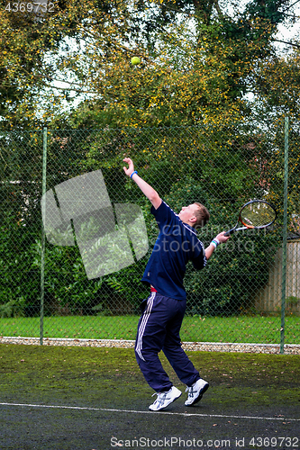 Image of Male playing Tennis