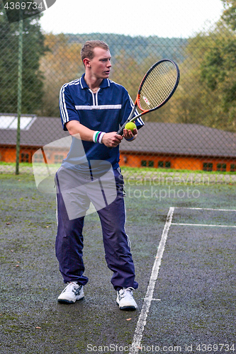 Image of Male playing Tennis