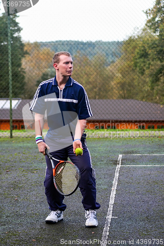 Image of Male playing Tennis