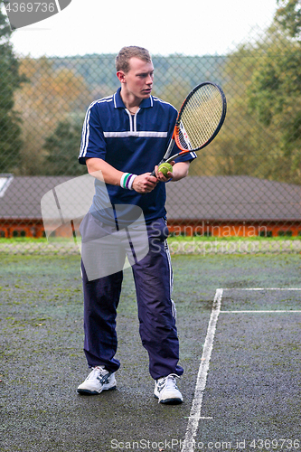 Image of Male playing Tennis
