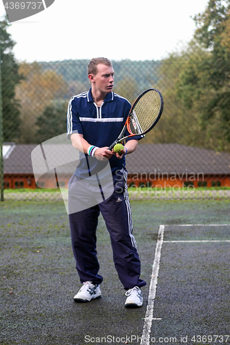 Image of Male playing Tennis