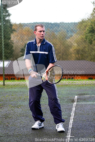 Image of Male playing Tennis